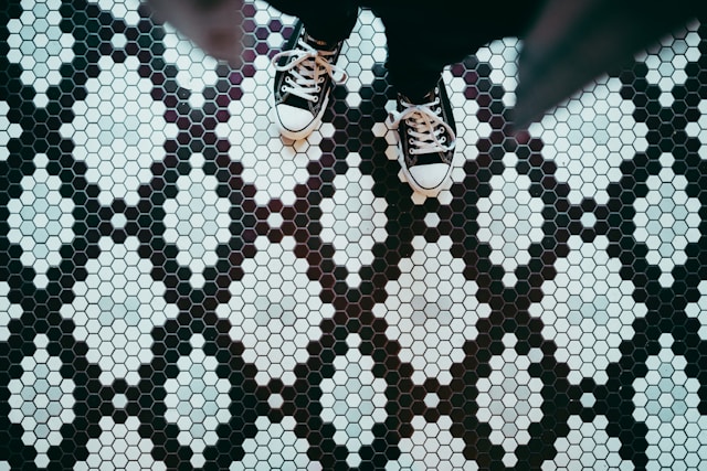 person-standing-wearing-black-sneakers